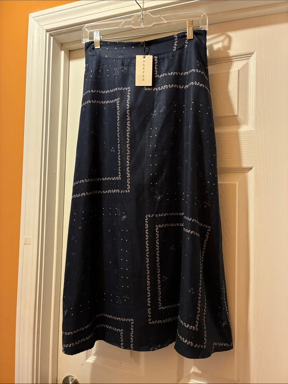 Harper Navy Blue Midi Skirt with bandana or paisley print pattern. It has lining